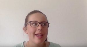Young white female teen with glasses discussing issues