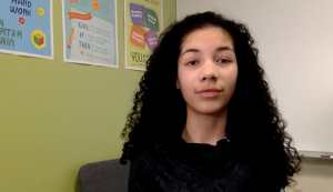 Young african-american female teen looking directly at camera